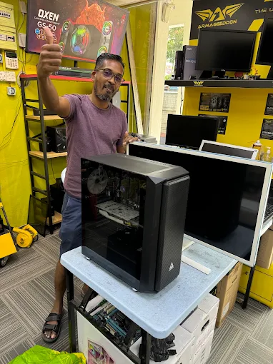 GMC specialist technician with completed custom PC system